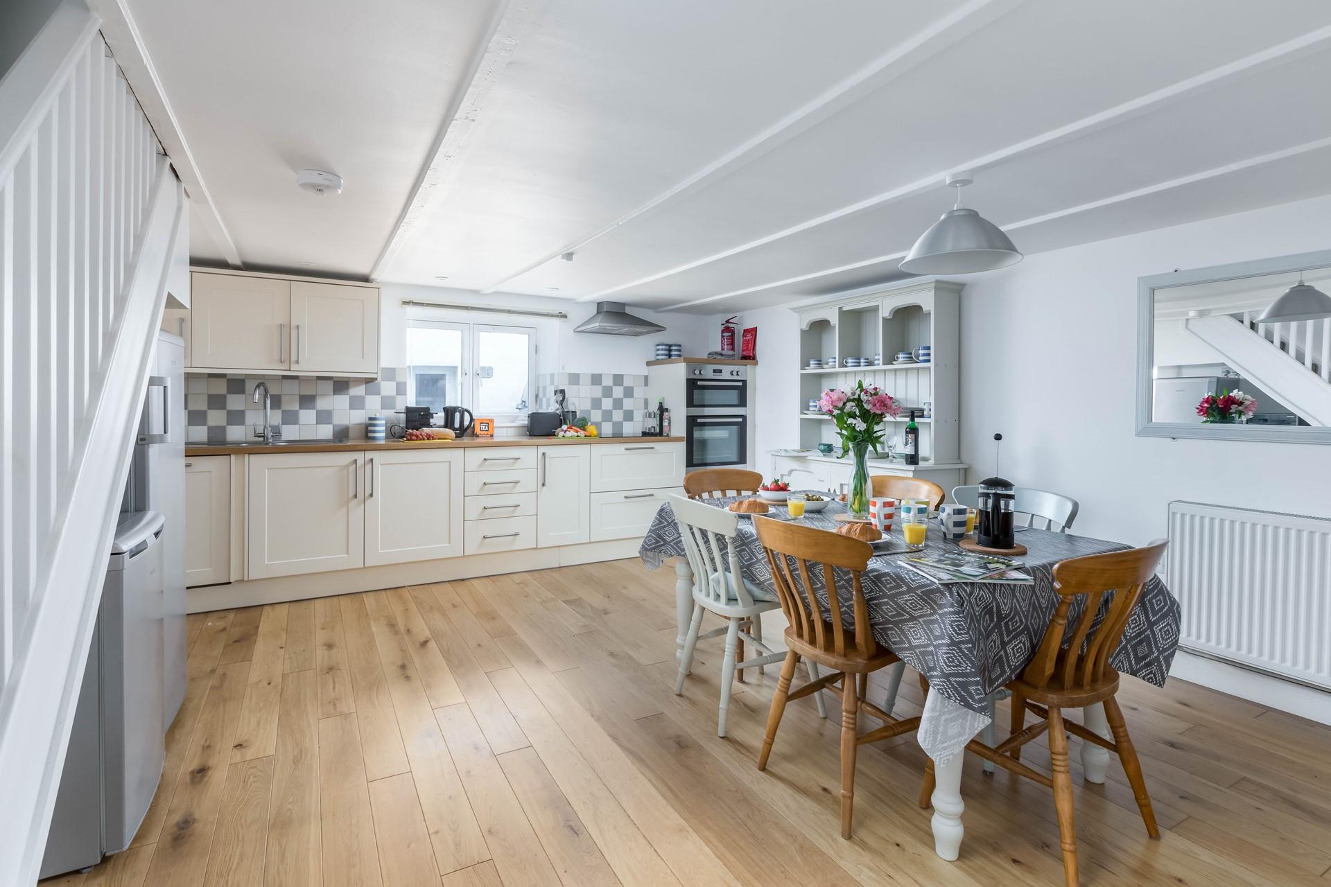 The kitchen has ample space for preparing family meals to all enjoy together.