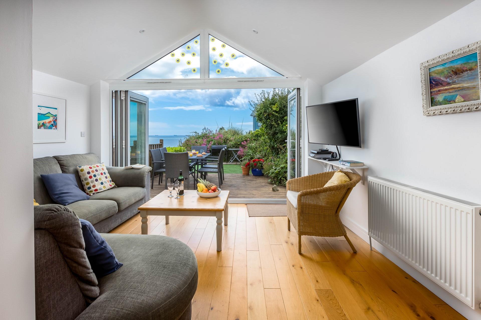 Watch the sunrise over the beach whilst sipping your morning coffee on the sofa.