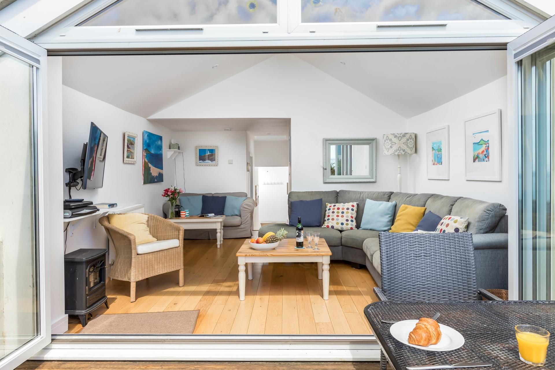 The large patio doors fill the room with light so you can sink into the sofa and enjoy the views.