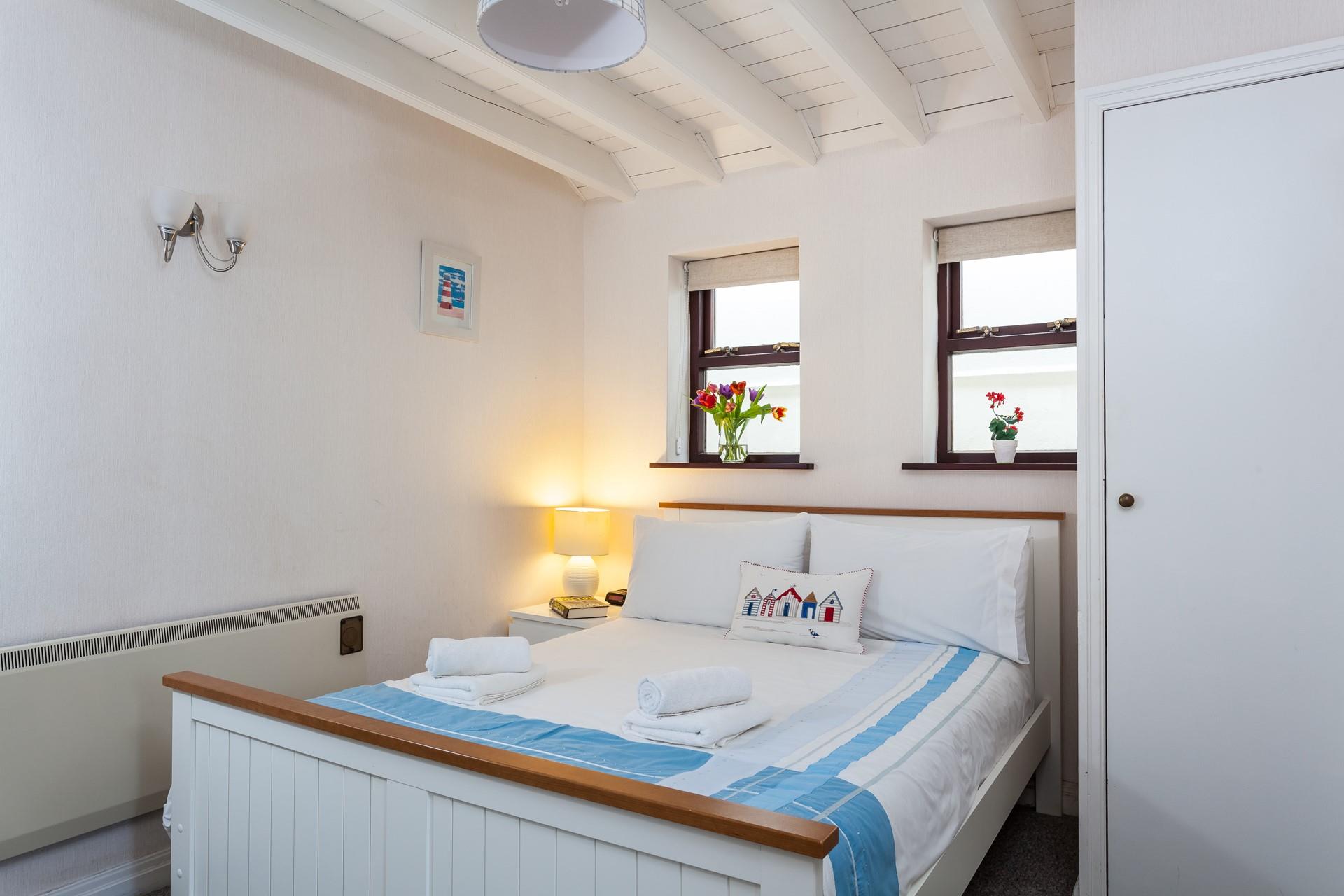 The double bedroom offers a blissful nights sleep after a day out at the beach.
