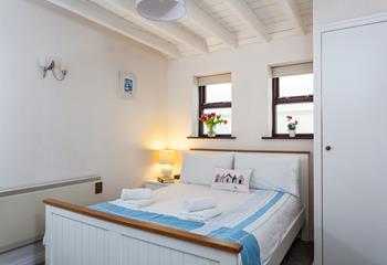The double bedroom offers a blissful nights sleep after a day out at the beach.