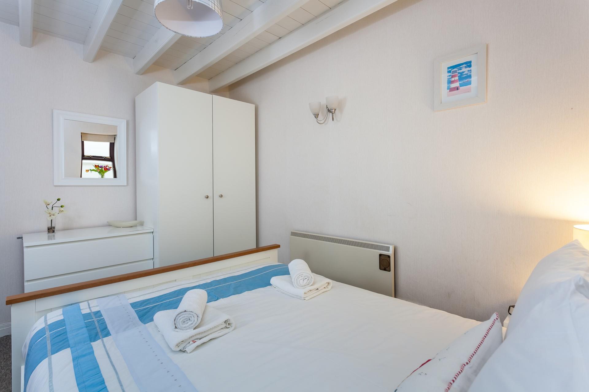 The second bedroom has all you need for a relaxing beachside staycation.