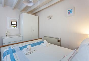 The second bedroom has all you need for a relaxing beachside staycation.