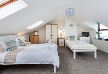 The main bedroom has a double bed and a single bed, perfect for a family holiday.