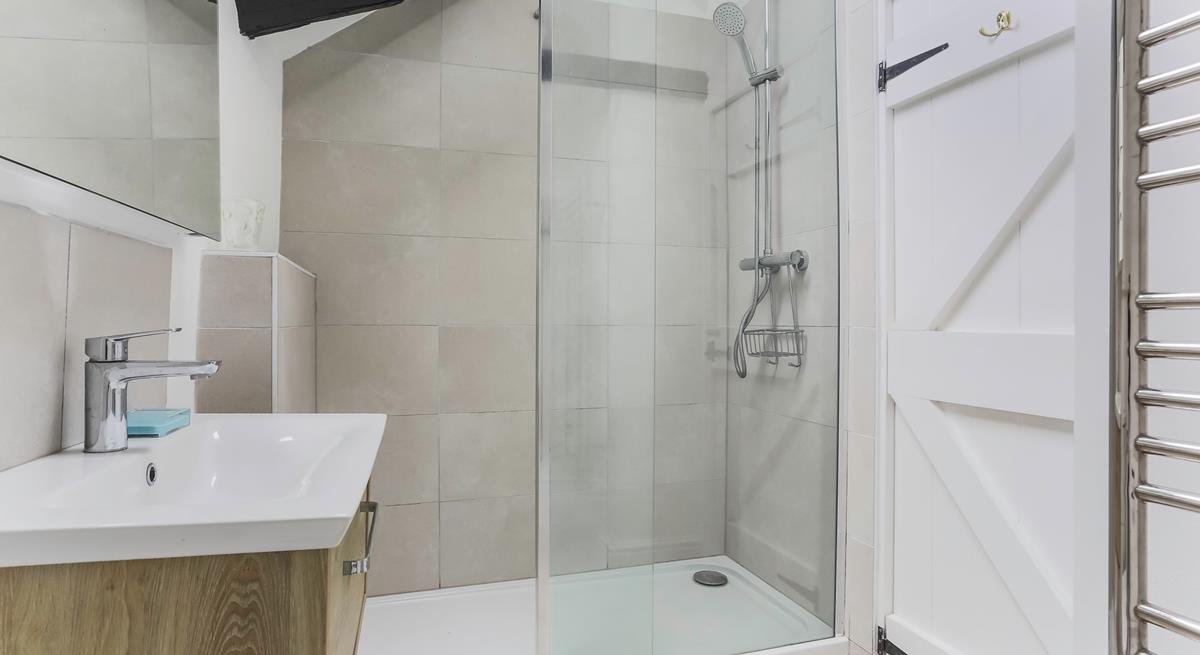 Start your day right with a hot shower and then head to the white sandy Porthcurno beach.