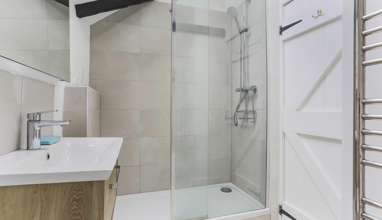 Start your day right with a hot shower and then head to the white sandy Porthcurno beach.