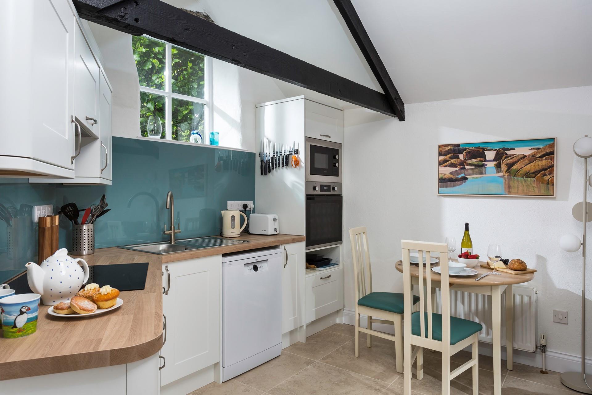 We love the exposed beams in the charming open plan living area.