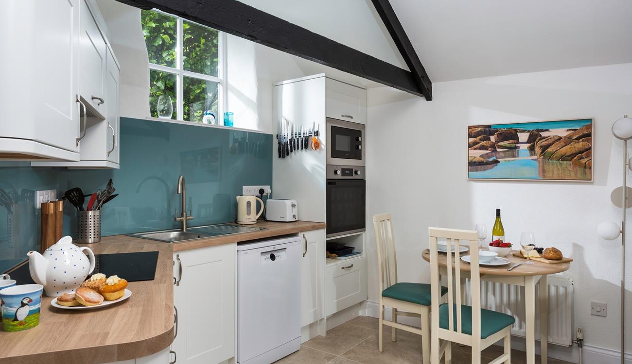 We love the exposed beams in the charming open plan living area.