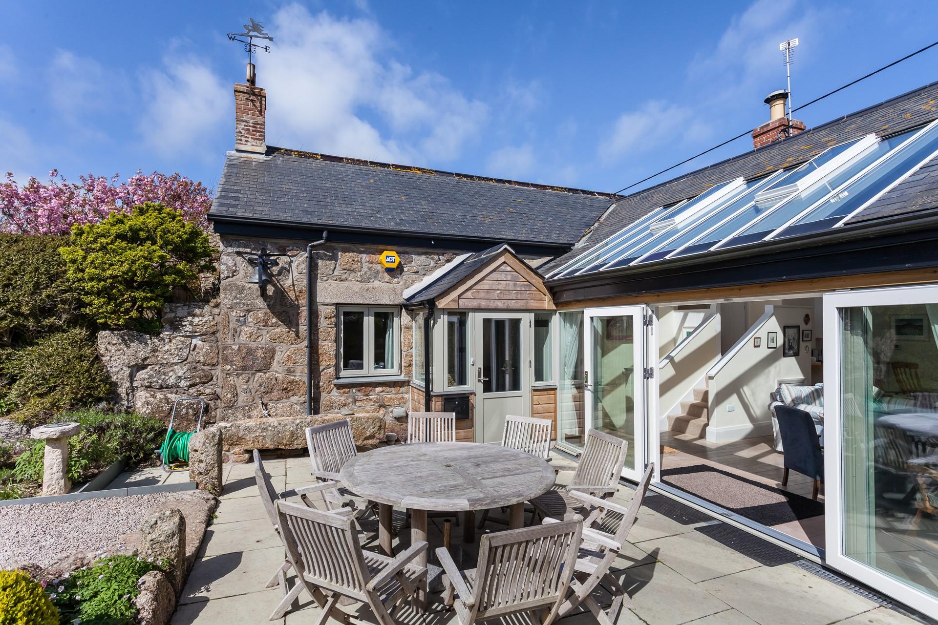 Open the bi-fold doors and let the fresh summer breeze run through the cottage.