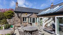 Open the bi-fold doors and let the fresh summer breeze run through the cottage.