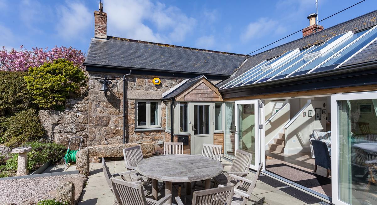 Open the bi-fold doors and let the fresh summer breeze run through the cottage.