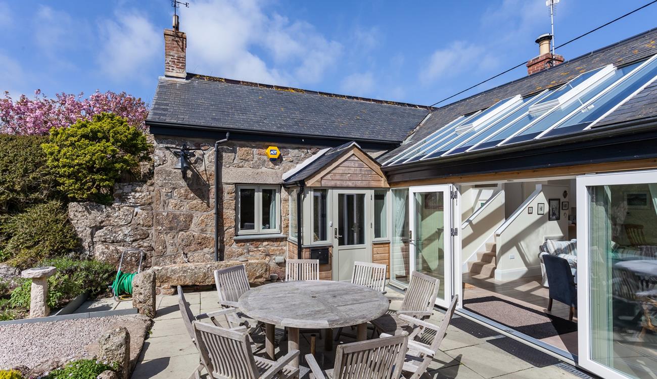 Open the bi-fold doors and let the fresh summer breeze run through the cottage.