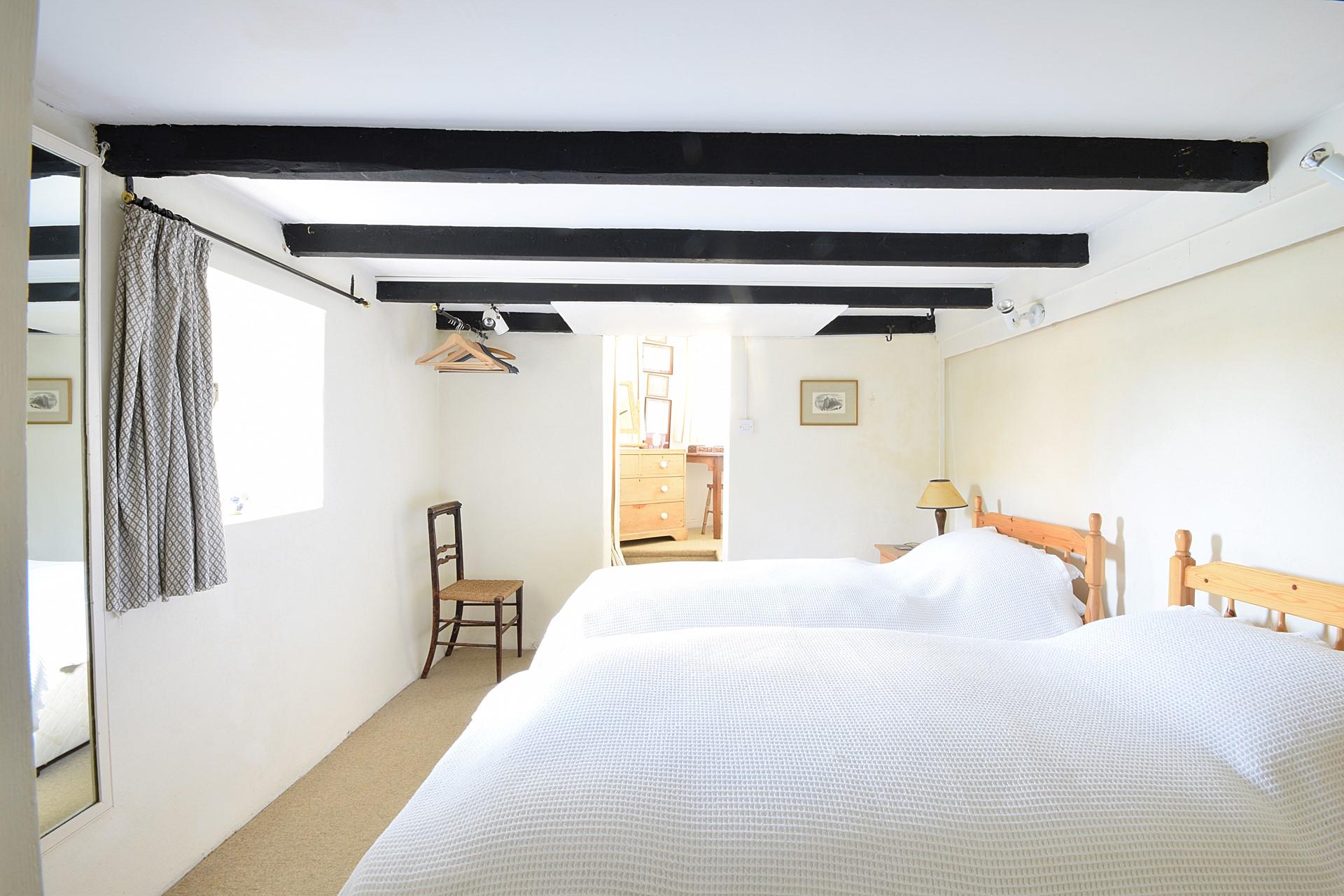 Traditional cottage features like exposed beams keep the cosy feel of this cottage.