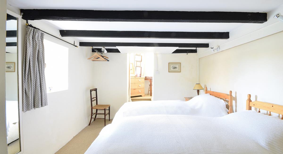 Traditional cottage features like exposed beams keep the cosy feel of this cottage.