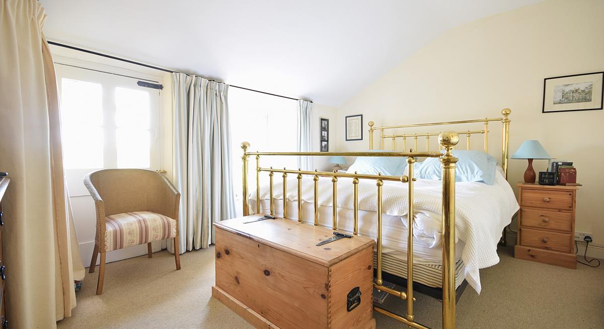 The sumptuous king size bed offers a blissful night's sleep.