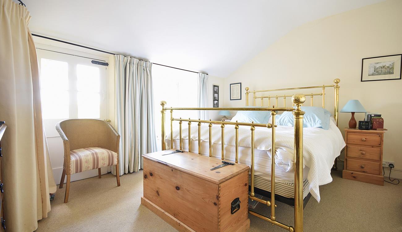 The sumptuous king size bed offers a blissful night's sleep.