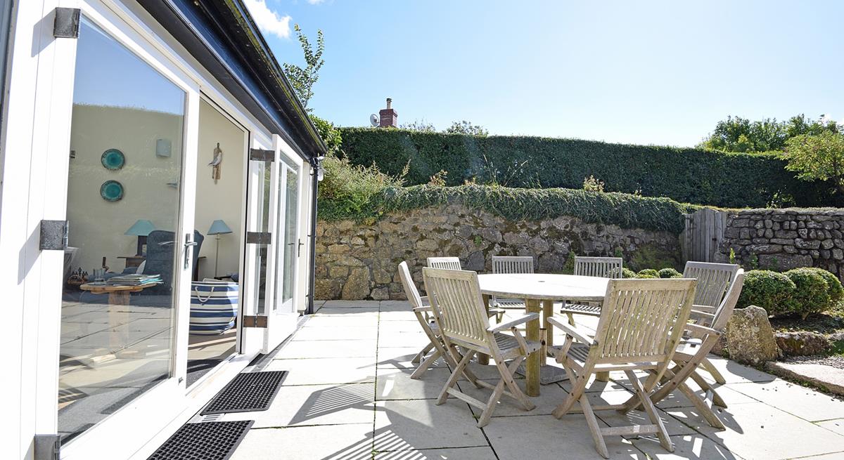 Sit outside in the sun trap garden and enjoy some al fresco dining.