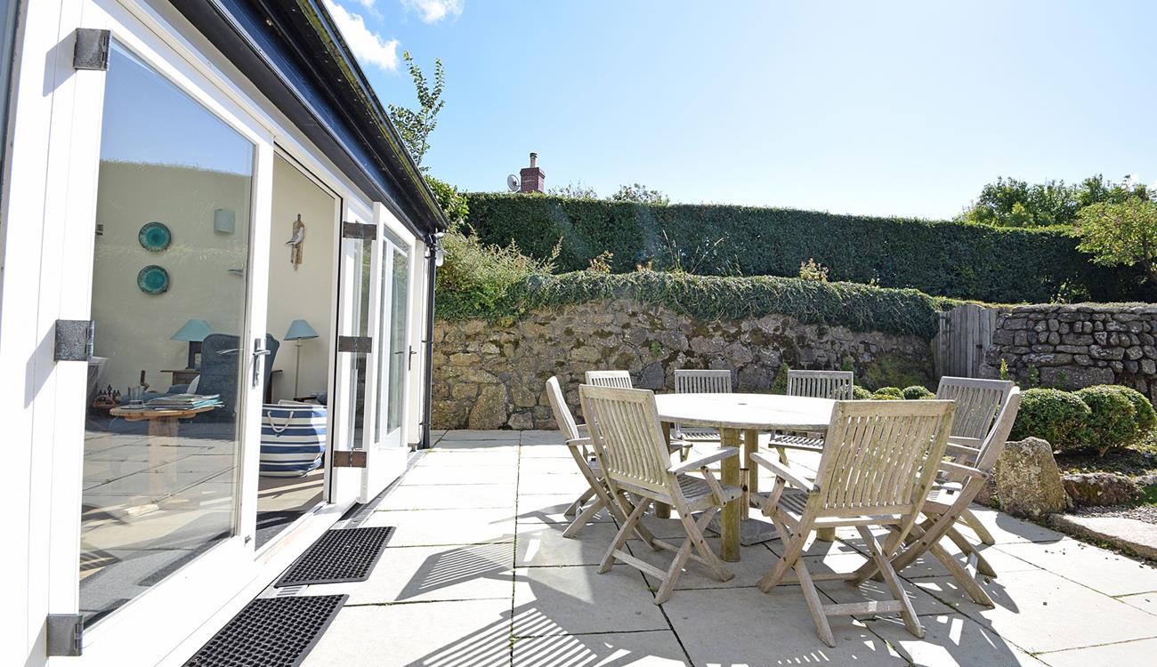 Sit outside in the sun trap garden and enjoy some al fresco dining.