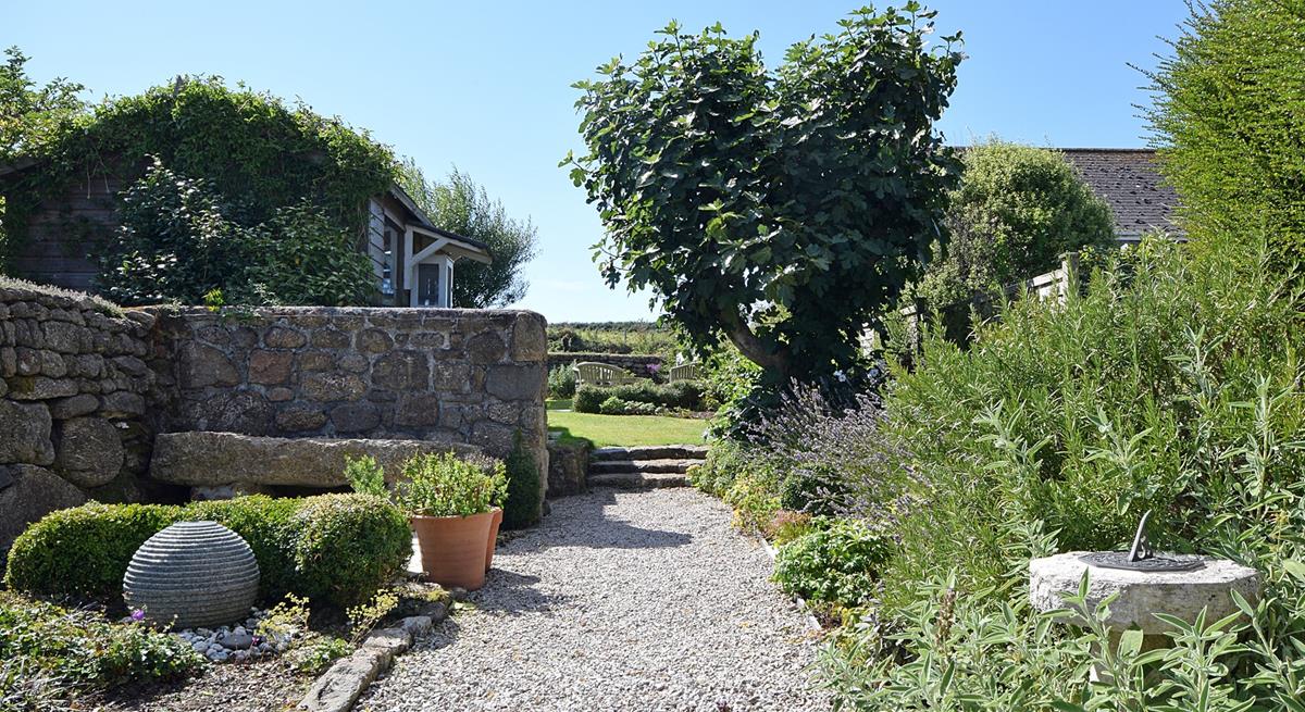 Sunbathe in the leafy garden on sunny afternoons.