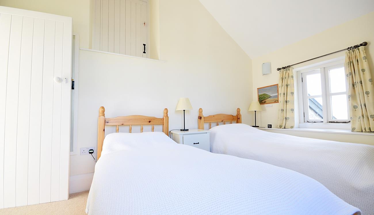 The twin beds are perfect for adults or children to settle into each night.