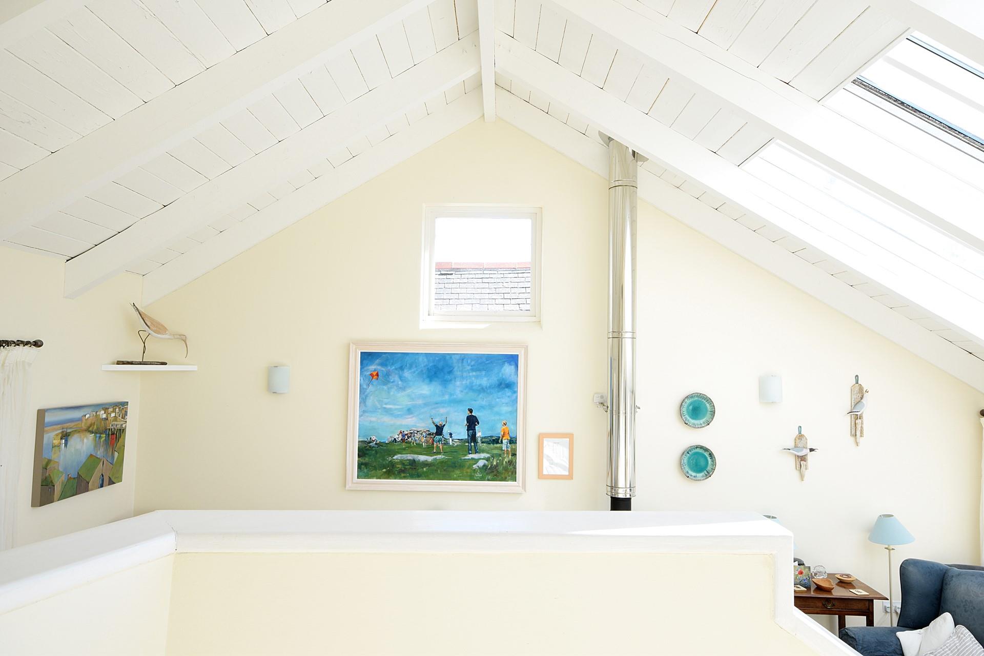 The staircase leads up to the bedrooms where you can enjoy a restful night's sleep.