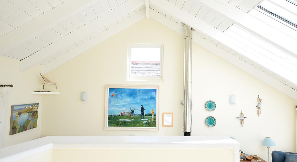 The staircase leads up to the bedrooms where you can enjoy a restful night's sleep.