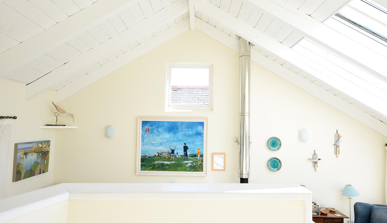 The staircase leads up to the bedrooms where you can enjoy a restful night's sleep.