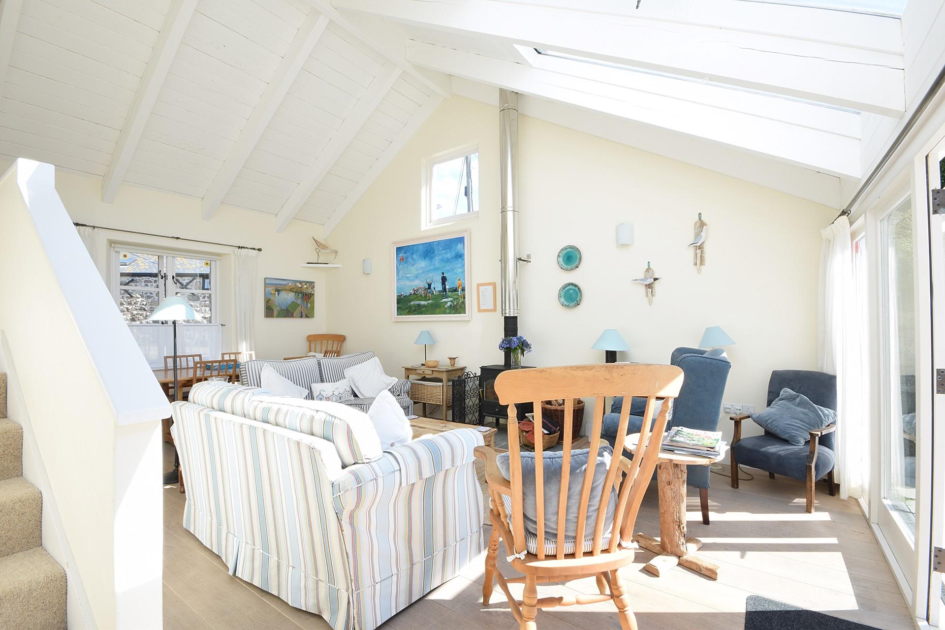 The comfortable sitting room is filled with seaside-inspired artwork.