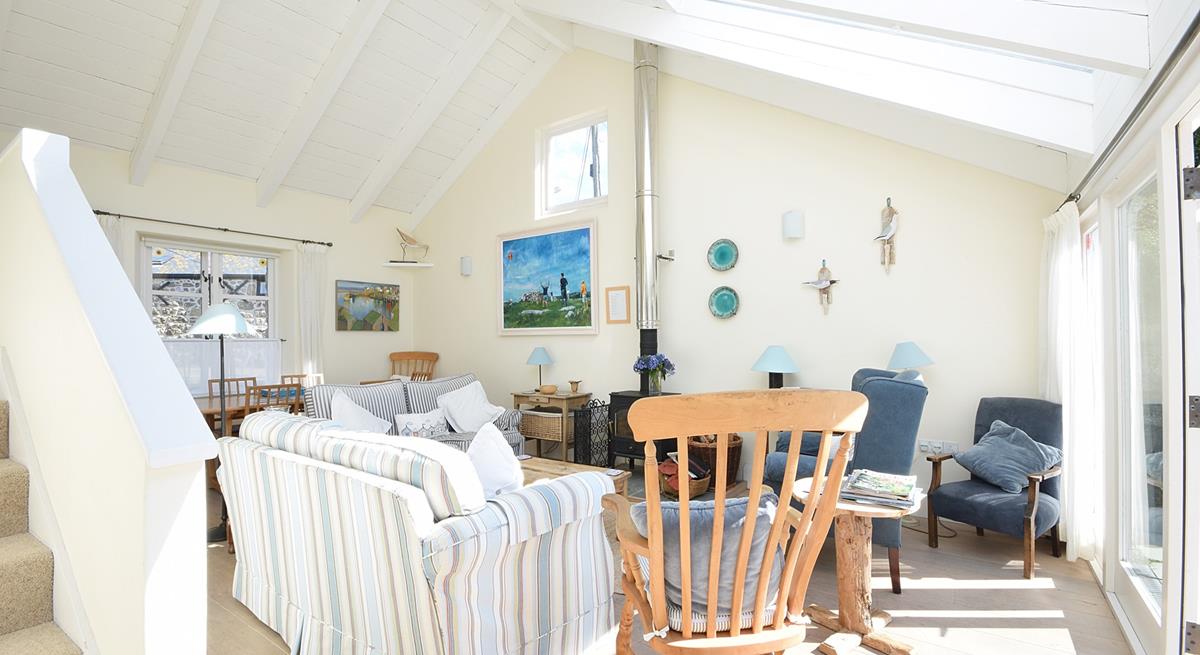 The comfortable sitting room is filled with seaside-inspired artwork.