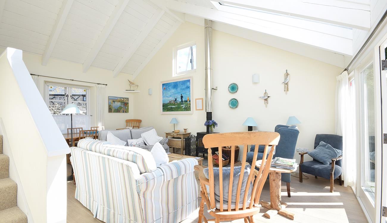 The comfortable sitting room is filled with seaside-inspired artwork.