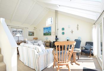 The comfortable sitting room is filled with seaside-inspired artwork.