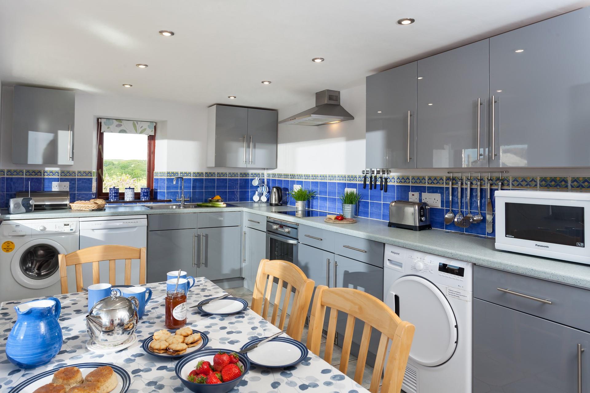 Sit around the table and indulge in a Cornish cream tea.