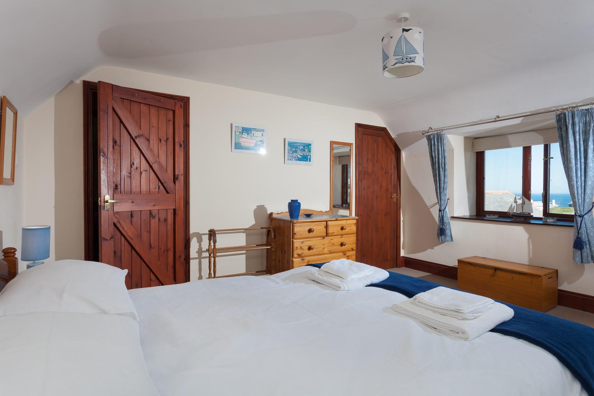 Wake up and open the curtains to stunning sea views.