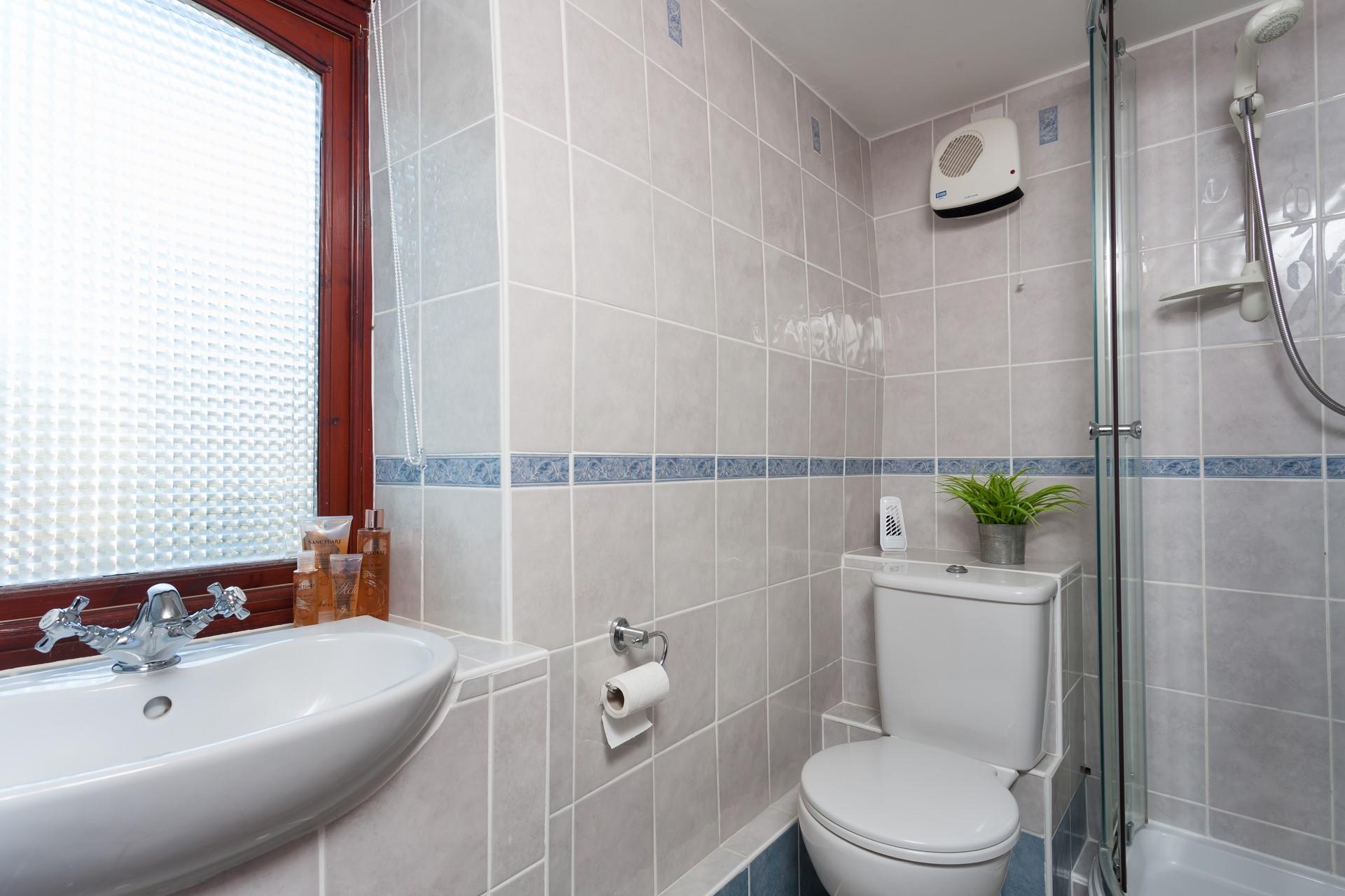 Wash off the sand in the shower before getting into your comfies and cosying up in the living with the fire on.