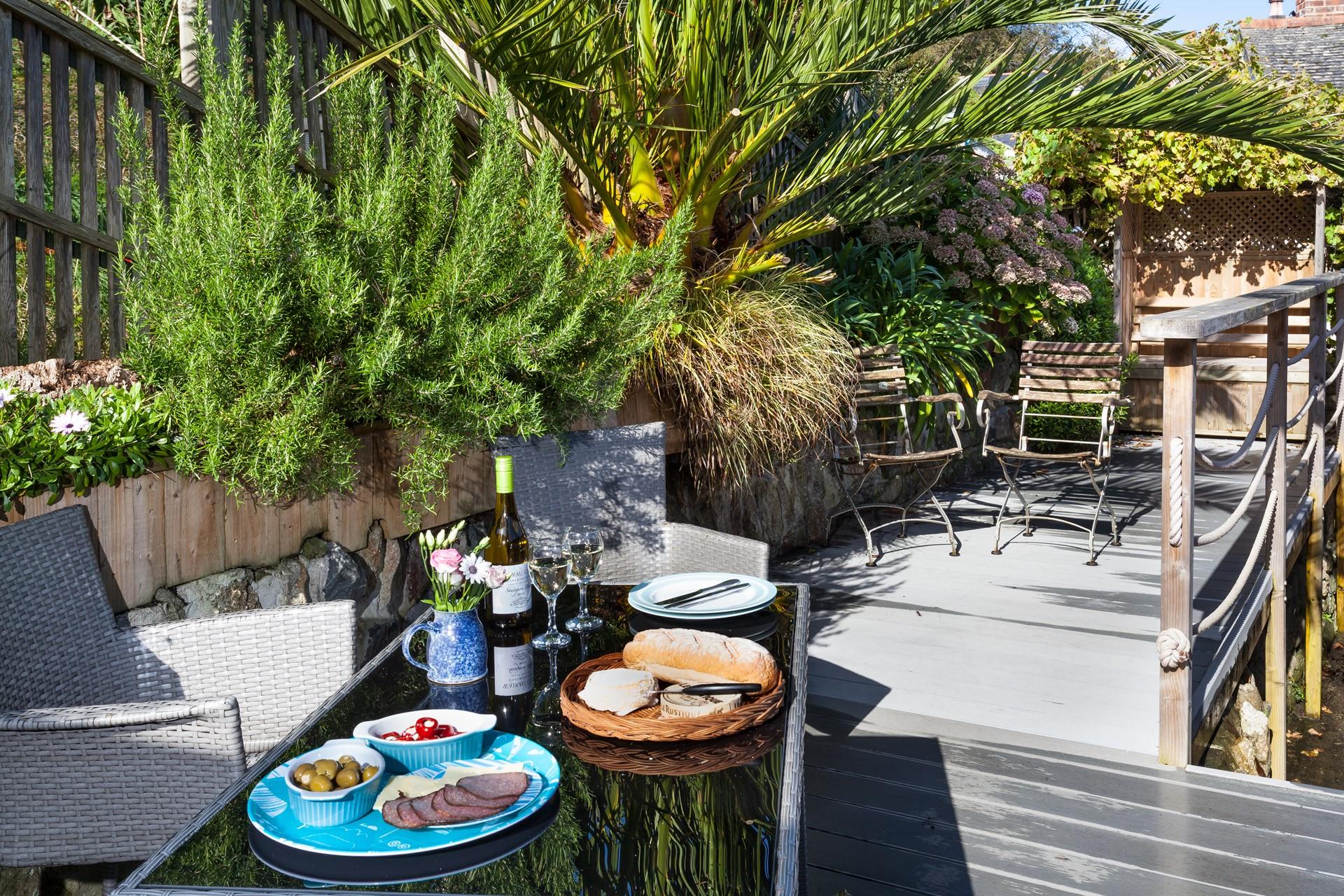 Spend long summer evenings relaxing in your garden sipping wine.