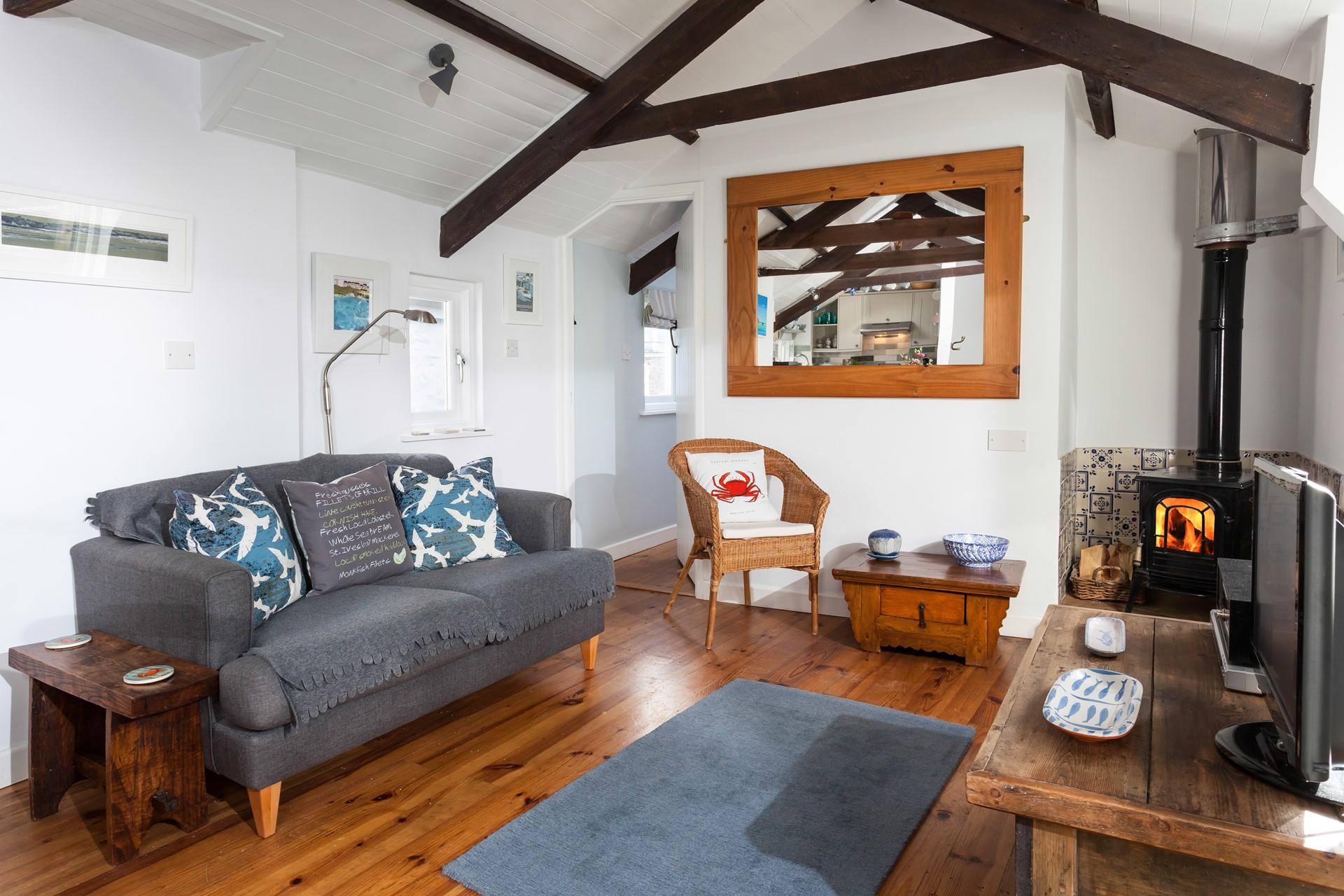 After a blustery beach walk, come back to snuggle up in front of the woodburner.