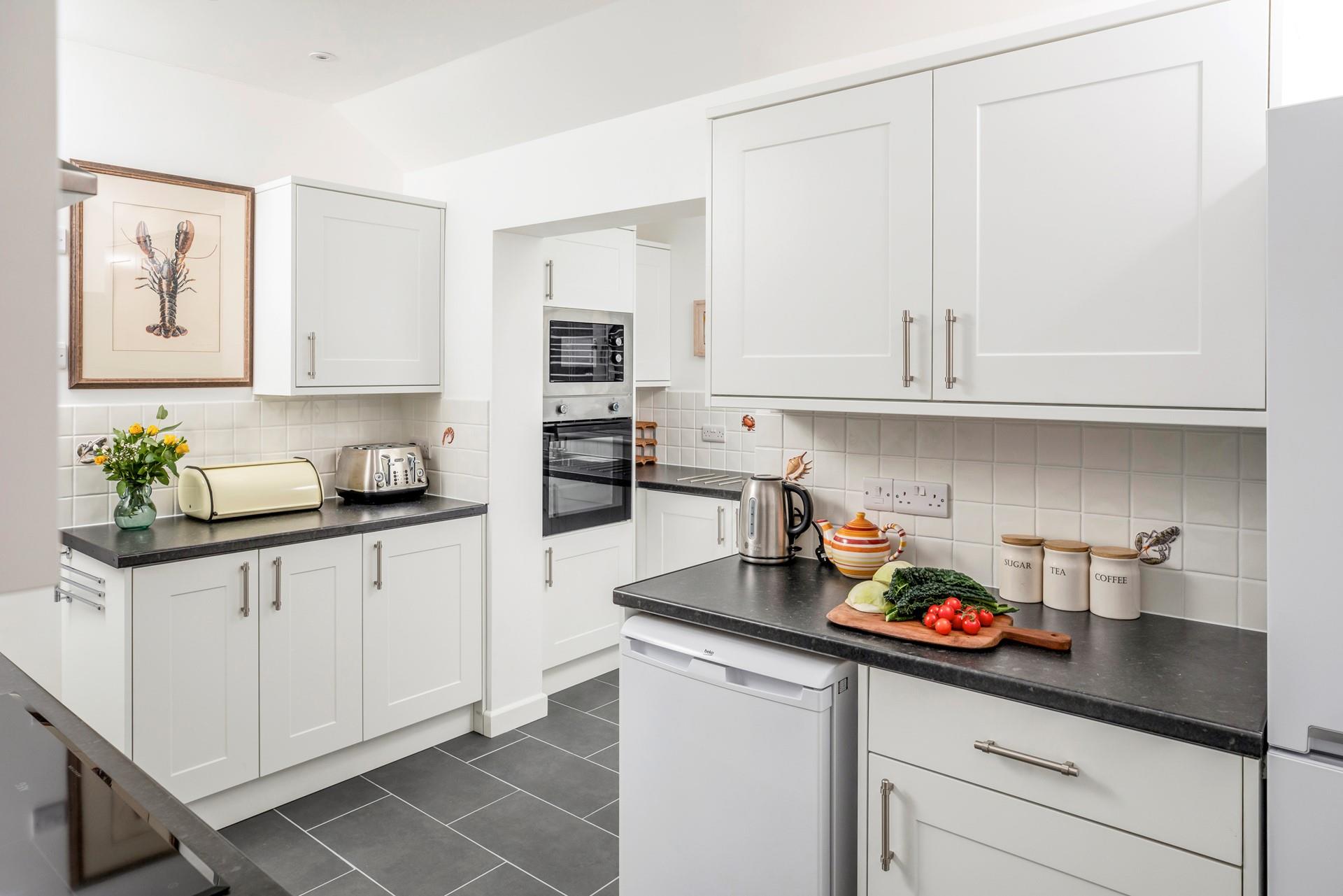 The spacious well-equipped kitchen offers you the perfect space to whip up delicious meals.