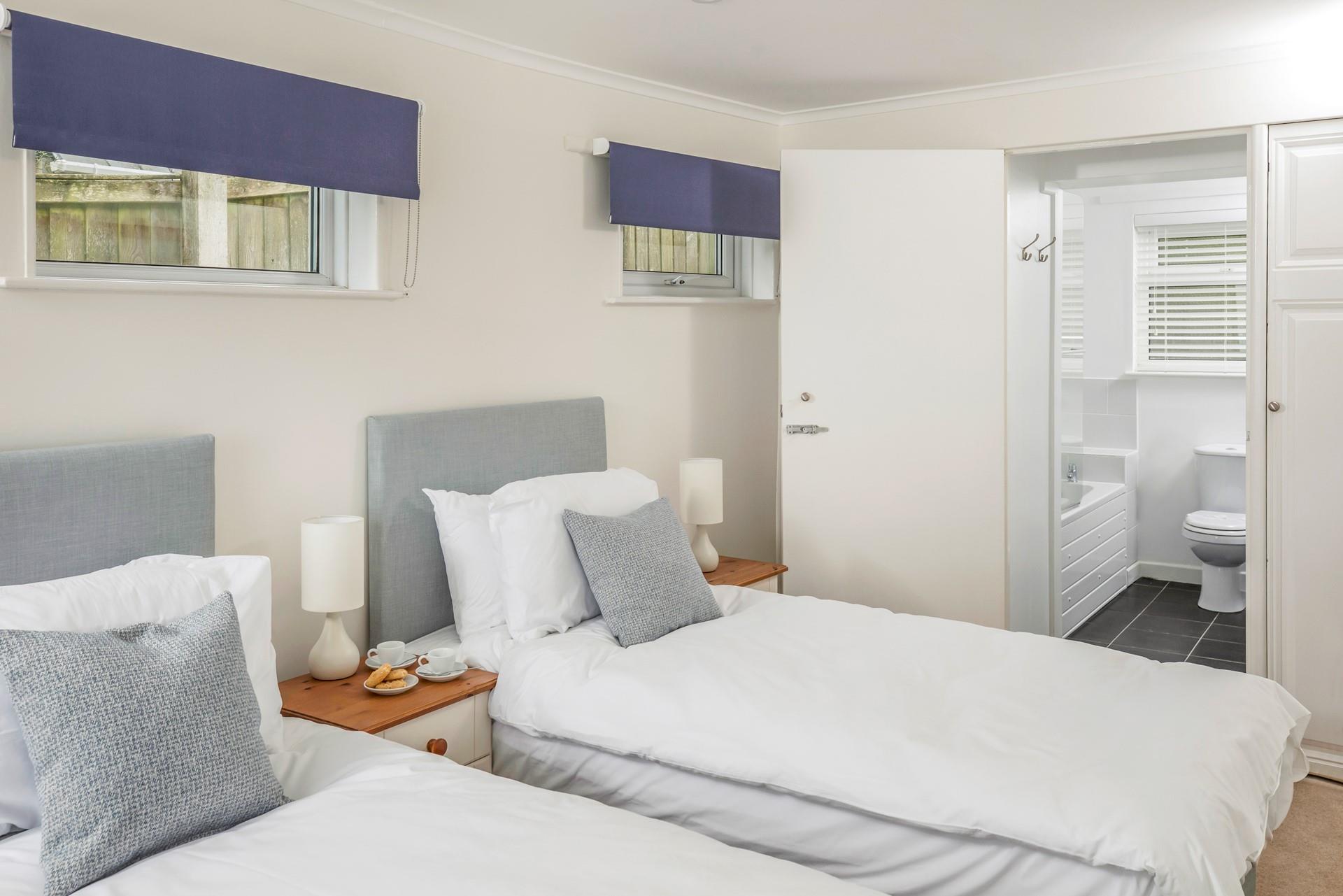 Bedroom 2 has twin beds, perfect for the kids.