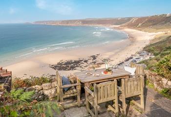 Watch the waves roll onto the beach as you sip your favourite tipple.