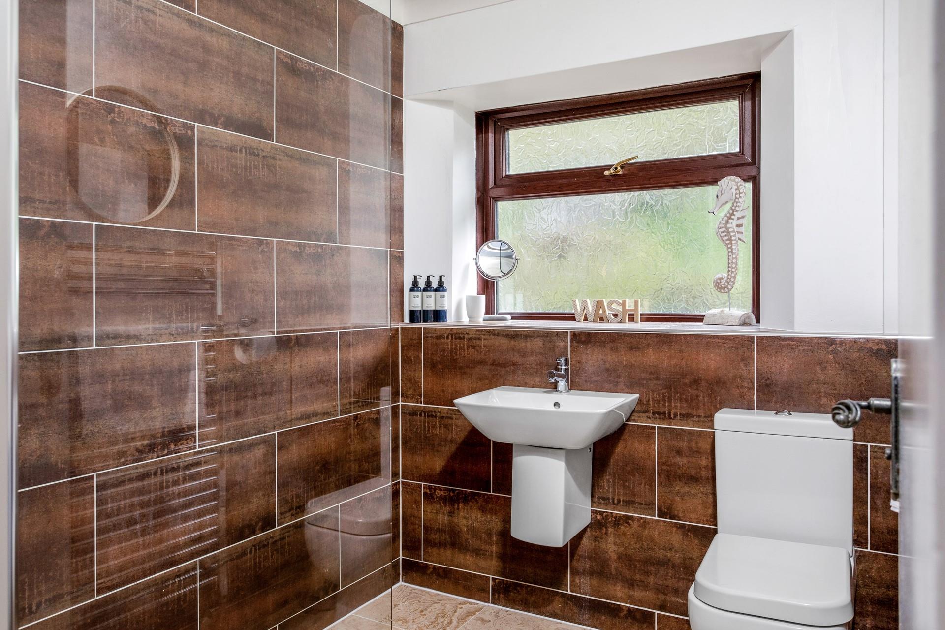 Wash off sandy toes from a day on the beach in the shower.