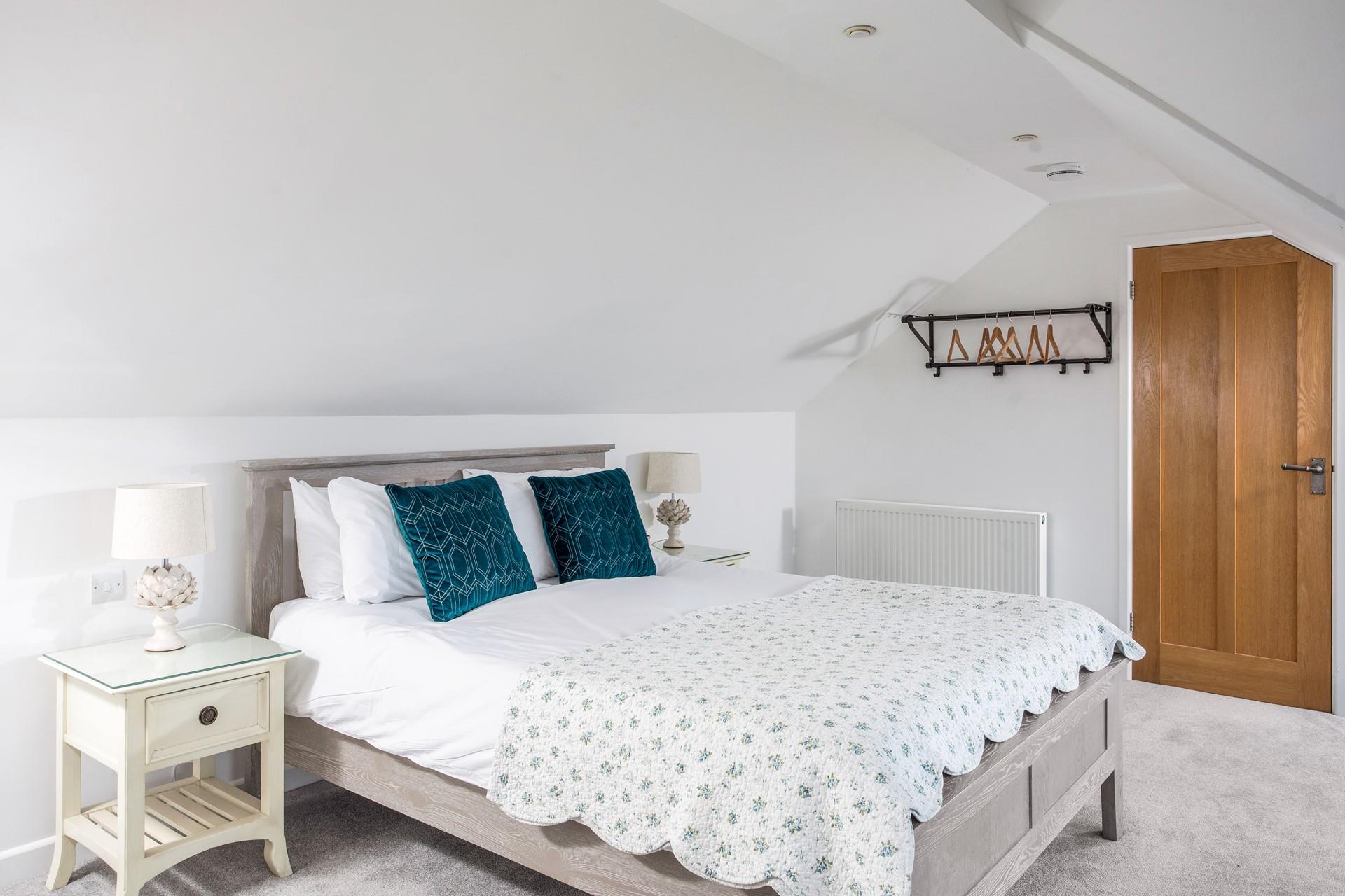 Stylishly decorated, bedroom 5 offers a peaceful night's slumber.