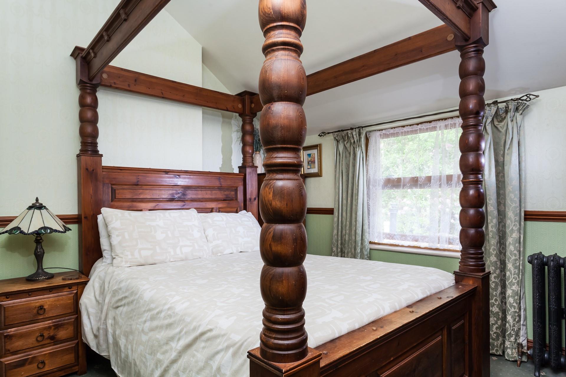 The four poster double bed in the 2nd bedroom offers a luxurious night's sleep.