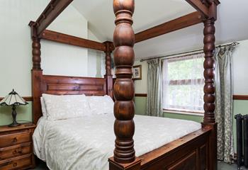 The four poster double bed in the 2nd bedroom offers a luxurious night's sleep.