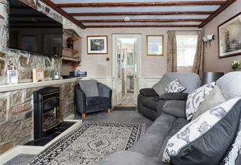 The comfortable sitting room includes a gas flame effect fire to keep you cosy in the evenings. 