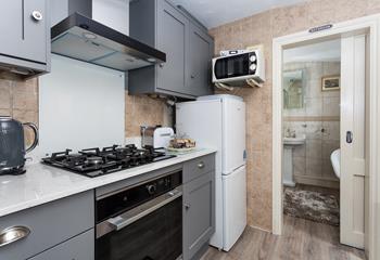 The recently refurbished kitchen is well-equipped for all your cooking needs.