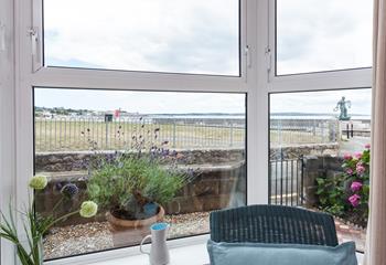 The living room has fantastic views towards Penzance and across Mounts Bay.
