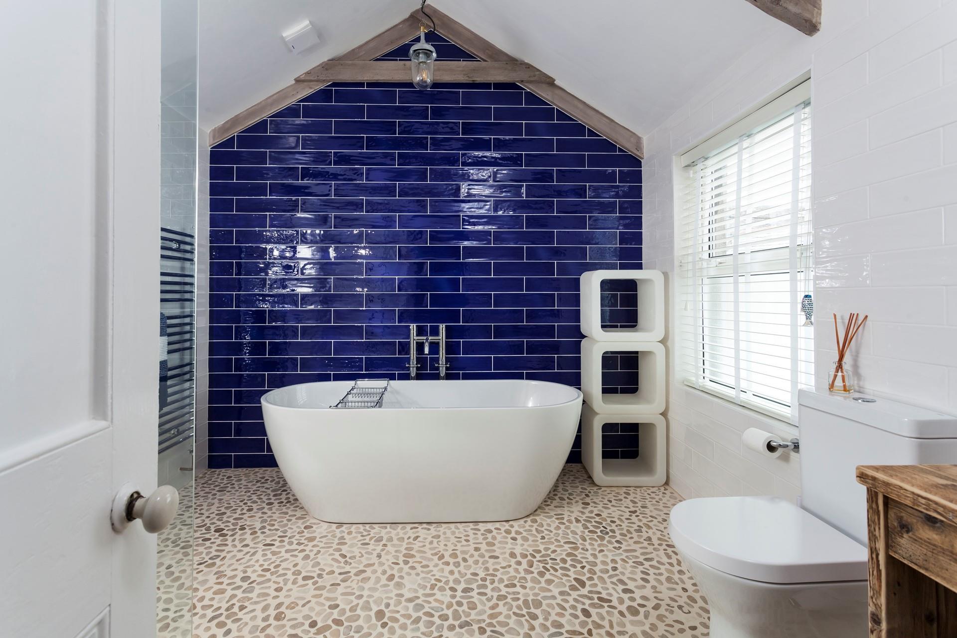 A luxurious bathing experience can be had in the spacious bathroom.