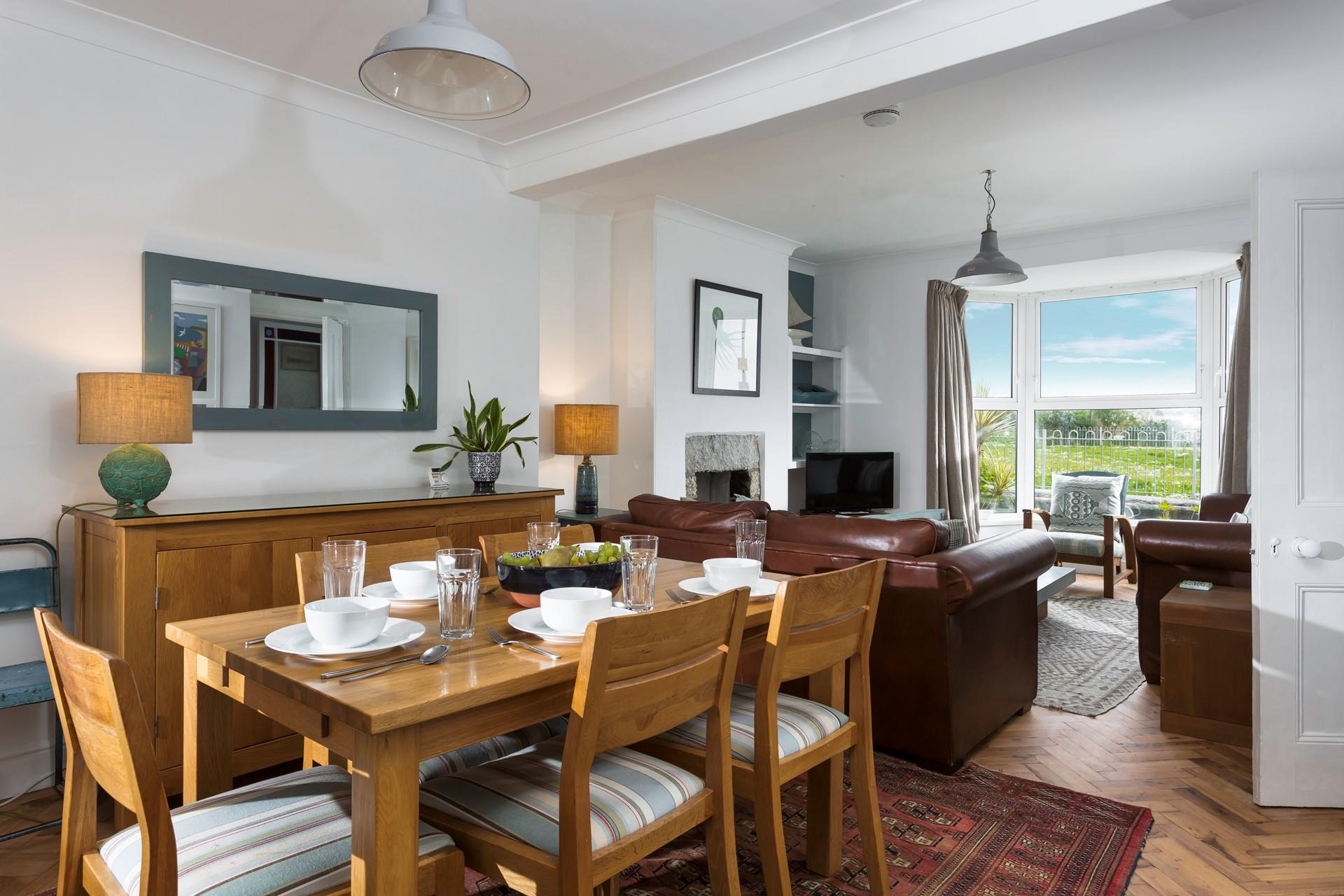 The dining area is set at the back of the living room. 