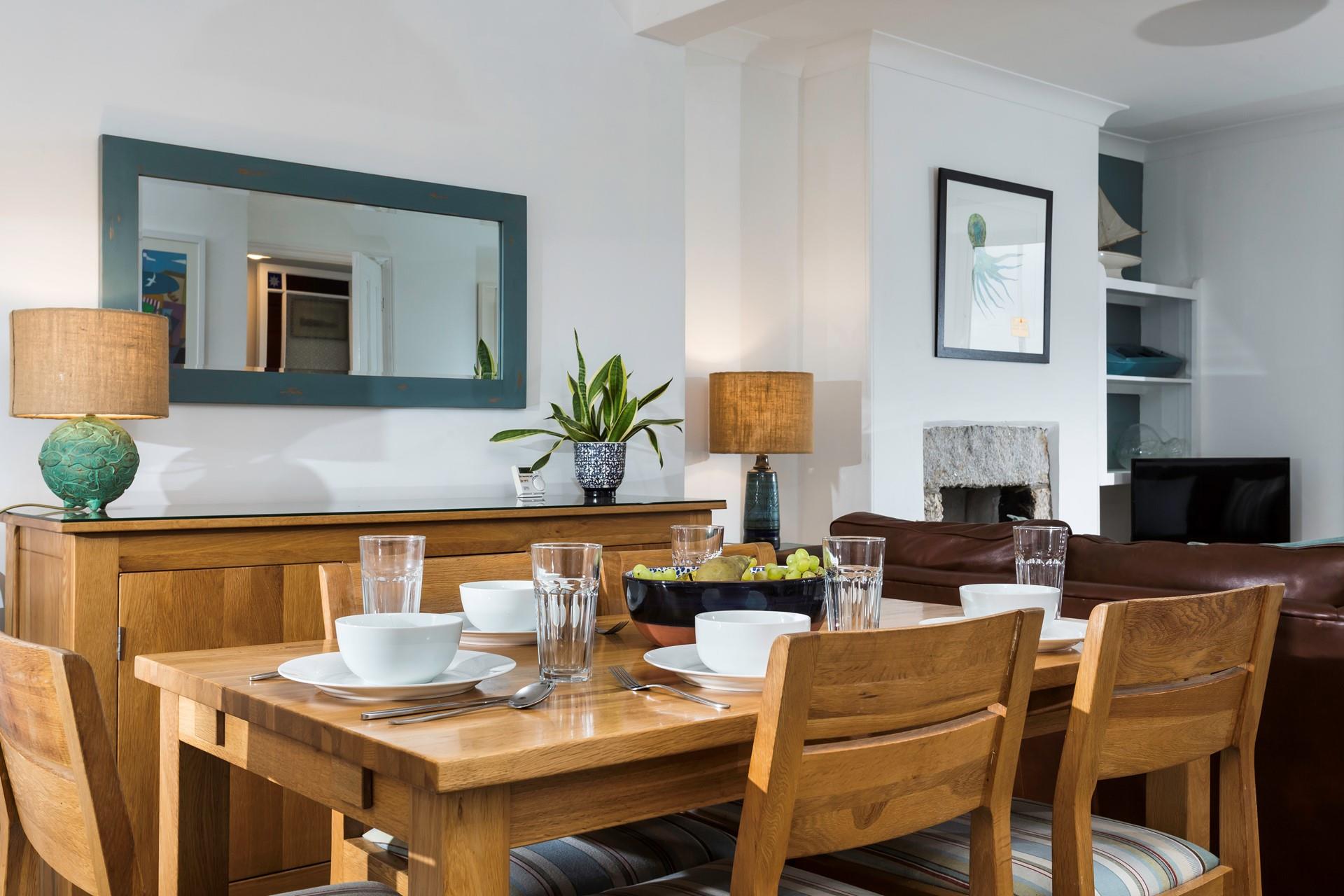 Sit around the dining table and tuck into a delicious meal with the family.