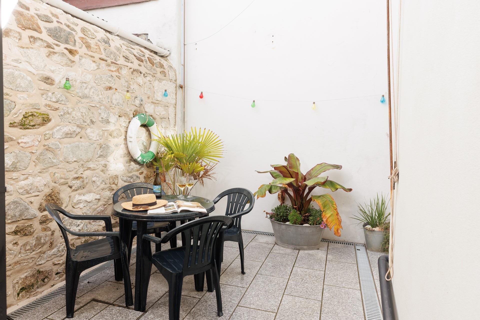 Soak up the sun in the courtyard with a glass of something cold.